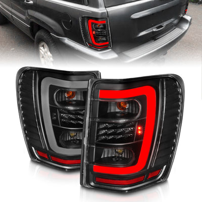 Black Housing LED Tail Lights w/Light Bar <br>99-04 Jeep Grand Cherokee